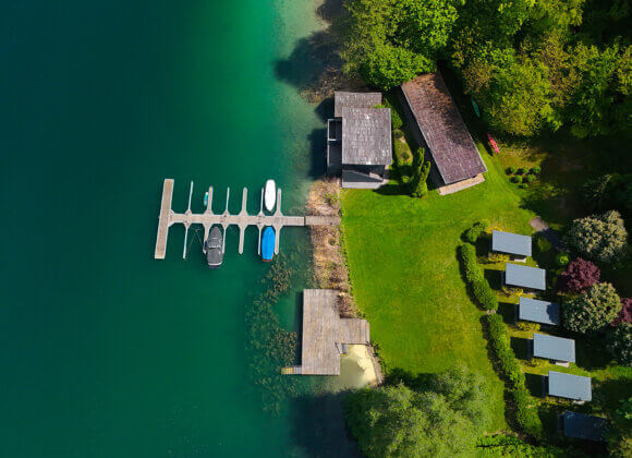 Property of the Week – THE VIEW, Luxury Penthouse on Lake Wörthersee with Its Own Boathouse lakeshore property-boat dock-luxury real estate-drone footage