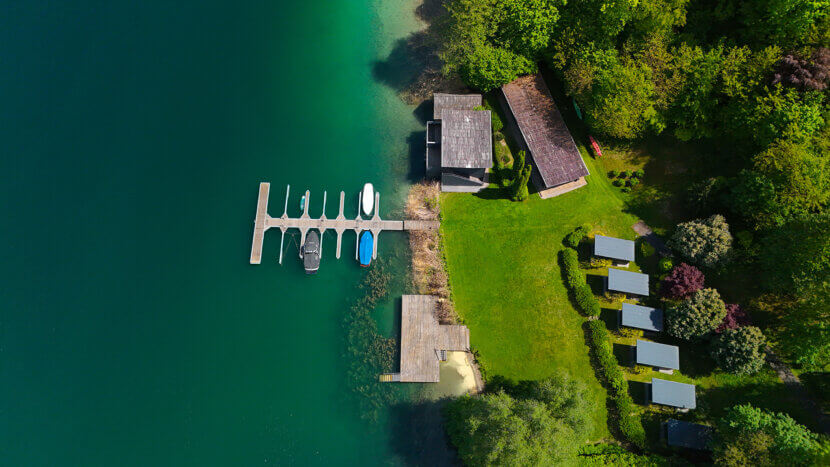 Property of the Week – THE VIEW, Luxury Penthouse on Lake Wörthersee with Its Own Boathouse lakeshore property-boat dock-luxury real estate-drone footage