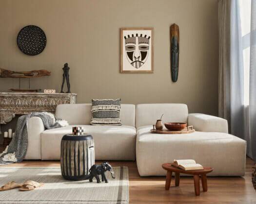 Stylish ethnic living room interior with a designer modular sofa, wo